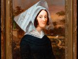 portrait of a woman in a black dress with a white bonnet