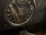 a close up of a speedometer on the dashboard of a car