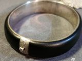 a close up of a bracelet on a table