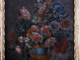 painting of a vase of flowers on a table in a gold frame