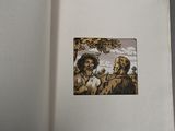 an open book with a picture of a man and a dog on it