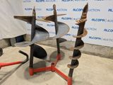 two plow attachments that are sitting on the ground