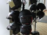 a display of helmets on a stand in a room