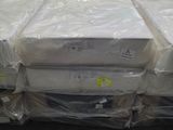 many boxes of mattresses stacked on top of each other