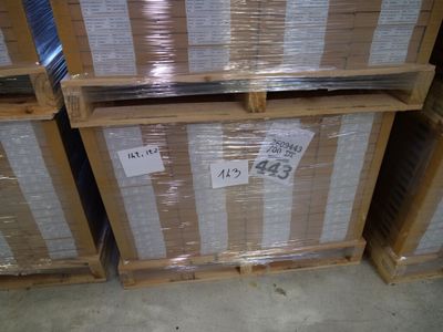 several boxes are stacked on top of each other in a warehouse