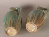 two vases that are sitting next to each other