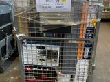 a metal cart with a sign on it in a warehouse