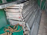 a pile of metal and rope sitting on a bench