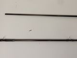a pair of fishing rods on a table next to a pair of scissors
