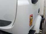 a white semi truck parked on the side of the road