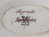 a close up of a plate with a name on it