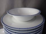 several plates stacked on top of each other with a bowl on top