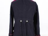 the back of a blue jacket with pink trims on a mannequin dummy