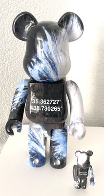 a black and white bear with a black vest on it