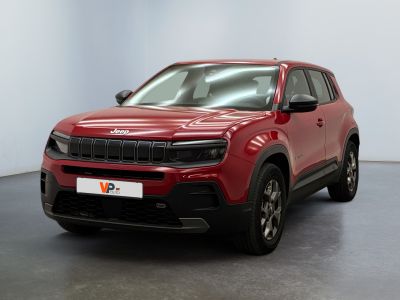the red jeep compass suv is parked in a white room