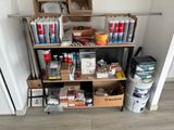 a shelf with many different items on it in a room