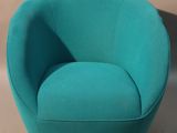 turquoise swivel chair in the shape of a ball