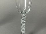 a wine glass that is sitting on a table