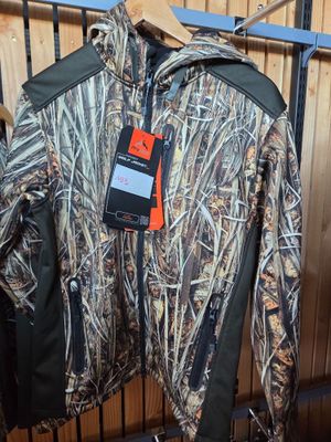 the jacket is hanging on the rack in the room