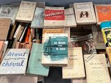 a lot of books that are sitting on a table