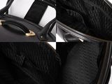 the inside of a black handbag with a zipper on it
