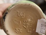 a person holding a cup that has a tag on it