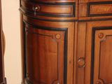 a wooden cabinet with a mirror on top of it