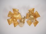 pair of vintage gold tone clip earrings with flower design