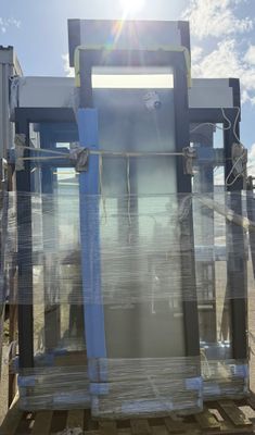 a picture of a blue toilet sitting on a pallet