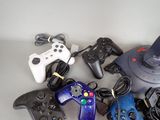 a lot of video game controllers sitting on a table