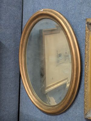 a picture of a painting and a mirror on the wall
