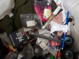 a pile of assorted items in a bin on the floor