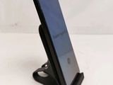 a cell phone that is sitting on a stand