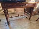 a wooden desk with a laptop on top of it