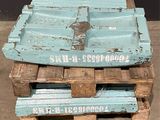 a stack of wooden pallets sitting on the ground
