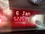 a digital clock on the dashboard of a car