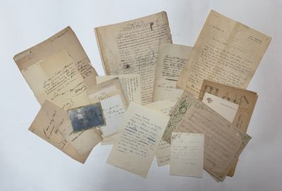a pile of old letters and papers on a table