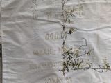 a white shirt with a picture of a flower on it