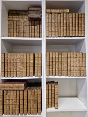 many books that are on the shelves in the room