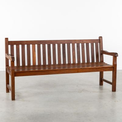a wooden bench that is sitting in the middle of a room