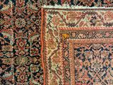 a close up of an antique rug with many different colors and patterns