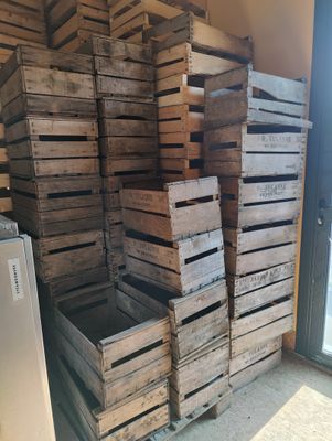 many wooden crates stacked on top of each other