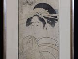 an old picture of a woman with a hat on her head