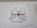 white cloth bag with a drawing of a pair of shoes on it