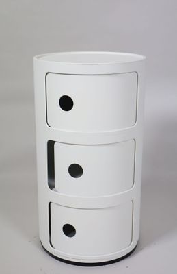 a white table with three drawers on it