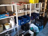 a room with a lot of boxes and containers on the shelves