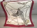 a picture of a red and white pillow with a bird on it