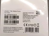 a close up of the back of a white phone with a barcode on it