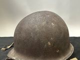 helmet on a black cloth on a black background with a white background