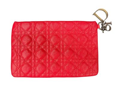 a close up of a red purse on a white background